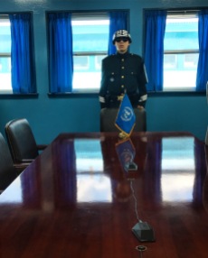One foot in North Korea... the line of microphones on the table divide the North from the South